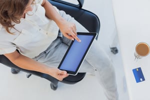 Overview of a designer using her tablet pc in her office